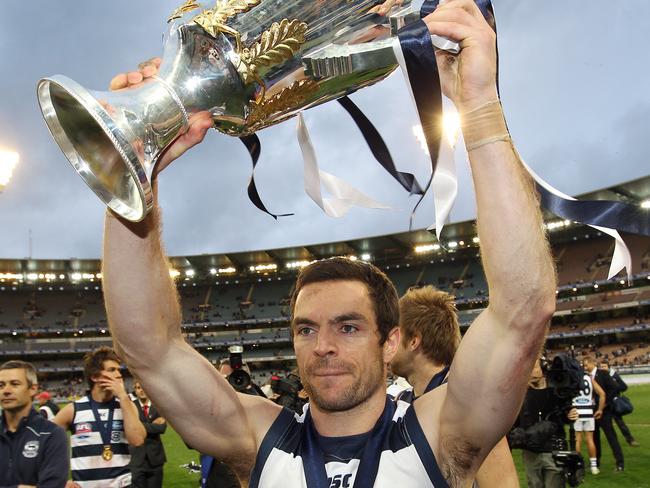 Matthew Scarlett holds the 2011 premiership cup aloft.