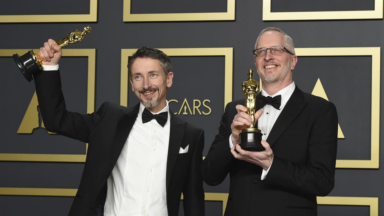 Best Sound Mixing:<i> 1917.</i> Stuart Wilson, left, and Mark Taylor, right, pose with their awards. Picture: AP