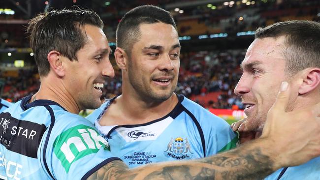 Mitchell Pearce, Jarryd Hayne and James Maloney celebrate.