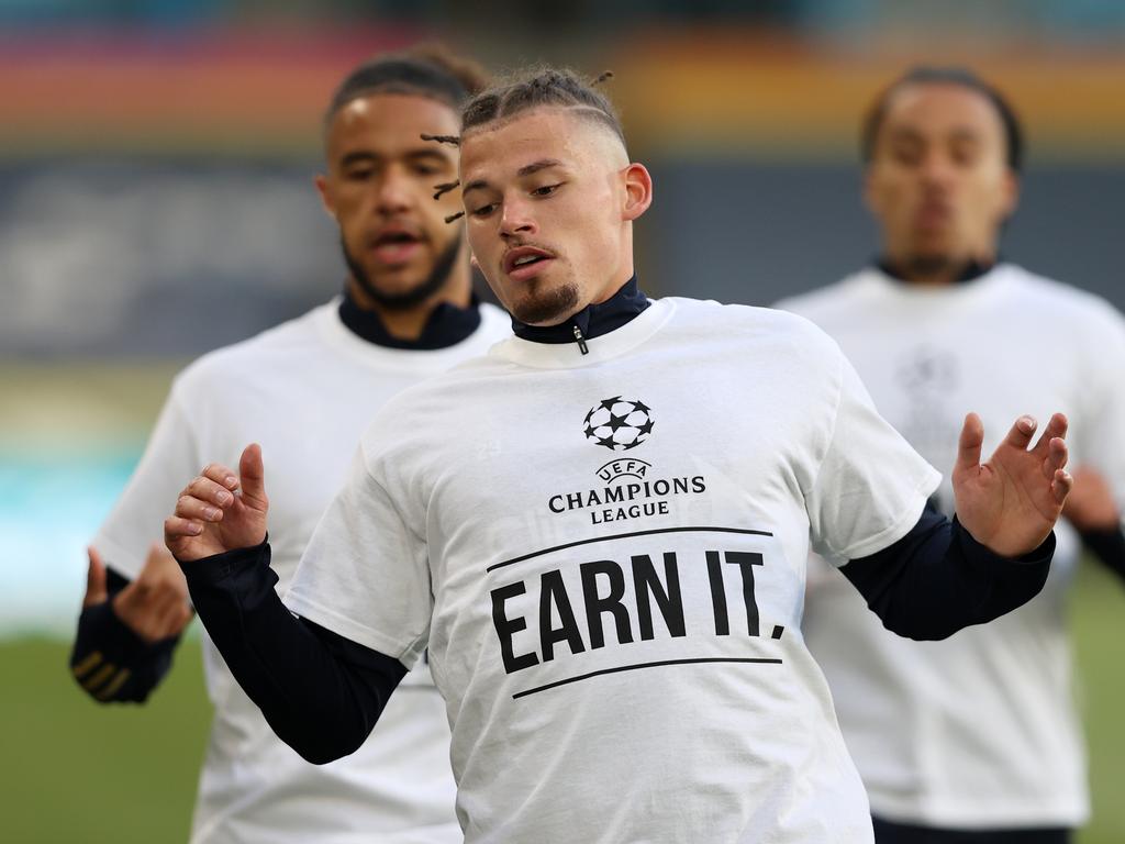 Kalvin Phillips of Leeds United warms up while wearing a protest T-shirt reading "Champions League, Earn it" prior to the Premier League match between Leeds United and Liverpool at Elland Road. (Photo by Clive Brunskill/Getty Images)