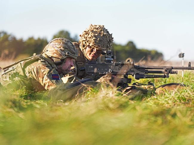 Prince William uses a general-purpose machine gun at the firing range. Picture: AFP