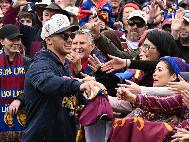 Cam Rayner embraces the Brisbane fans. Picture: Quinn Rooney/Getty Images