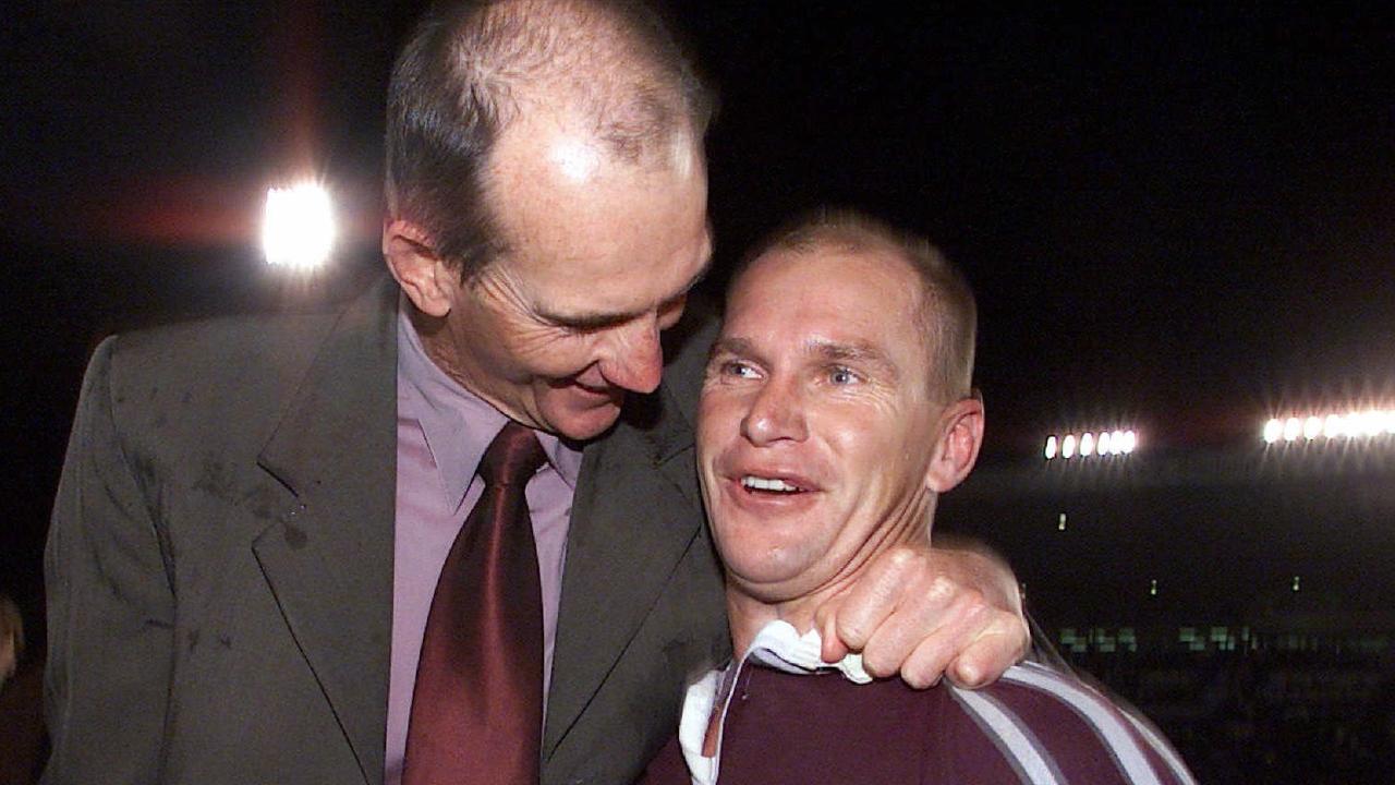 A smiling Maroons coach Wayne Bennett embraces Alf Langer in 2001.