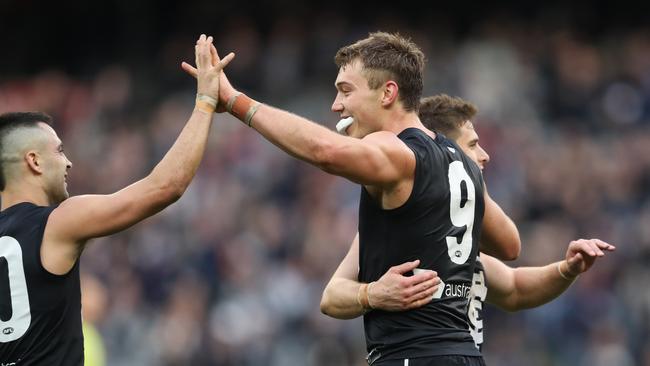 Michael Gibbons and Patrick Cripps celebrate Carlton’s win over Adelaide in Round 19. Picture: AAP Image/David Crosling