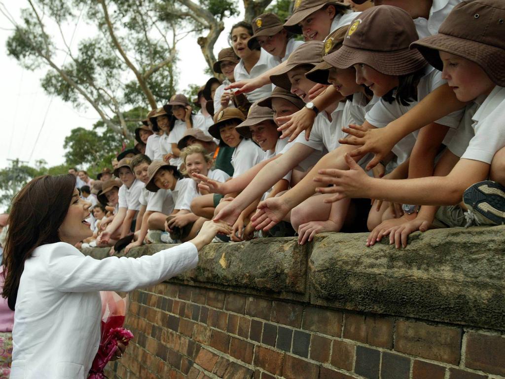 Princess Mary greets hundreds of Claremont College students lining Coogee Bay Road during an unscheduled visit to the Young Women's Health Program. Picture: Brett Costello