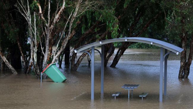 Lakewoods reserve on 19th Avenue Elanora turns into a giant lake flooding the BBQ area and basketball court after torrential rain over night causing the creek to break its banks. NCA NewsWire / Scott Powick