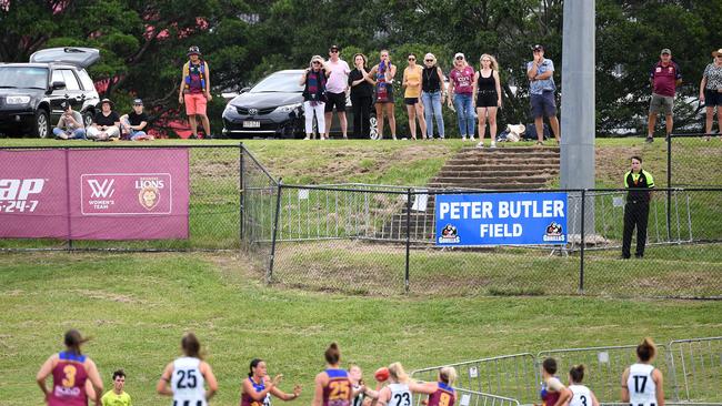 A handful of fans watch the match from behind the fence. Picture: AAP Image/Dan Peled