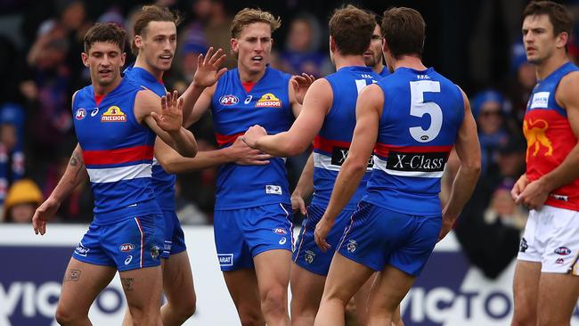 Aaron Naughton is congratulated by teammates after kicking a goal. Picture: Getty Images