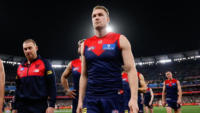 Tom McDonald and the Demons walk of the MCG on Friday night. Picture: Dylan Burns/AFL Photos