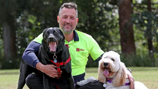 Pride of Australia - Postman Richard Pumpa was first to respond to a house fire while on his delivery run in Asquith and his reaction helped save the house from total destruction. He also rescued dogs Poppy (Groodle) and Zac (Labrador) from inside the burning house. Picture: Toby Zerna