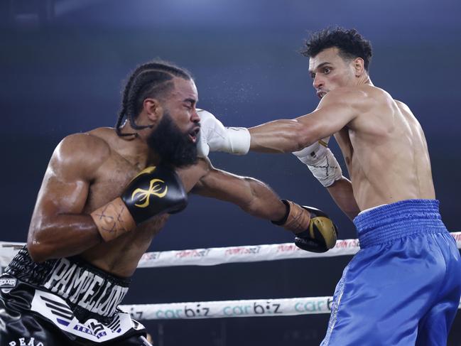 Malik Zinad lands a punch on Jerome Pampellone. Picture: No Limit Boxing