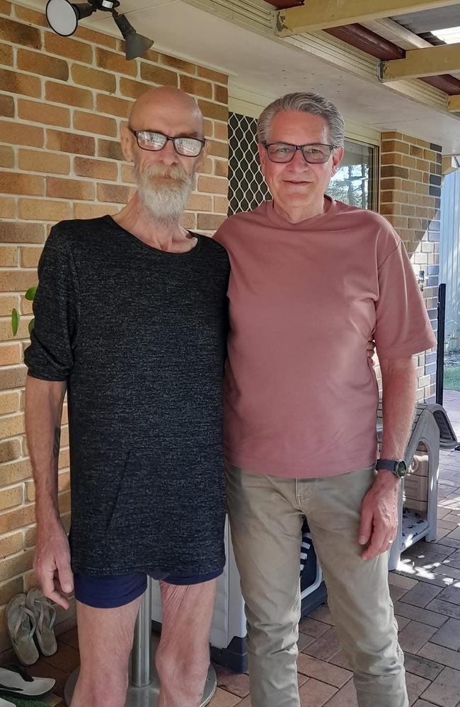 An almost unrecognisable Craig, pictured at his home with Reverend Michael Mackrell (right), when his weight plummeted 55kg. Photo: Supplied.