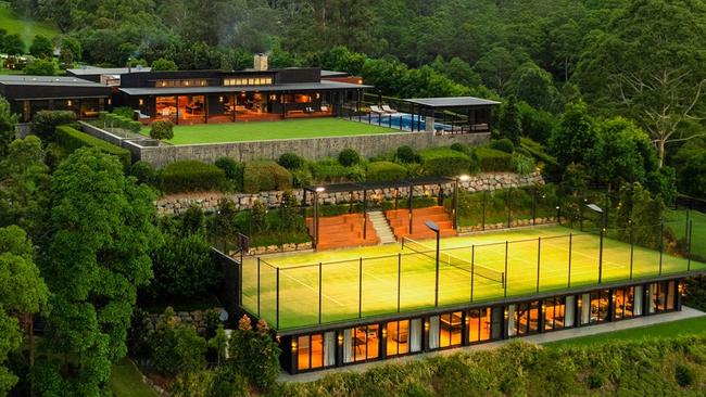 The property has a tennis court with a large room underneath.