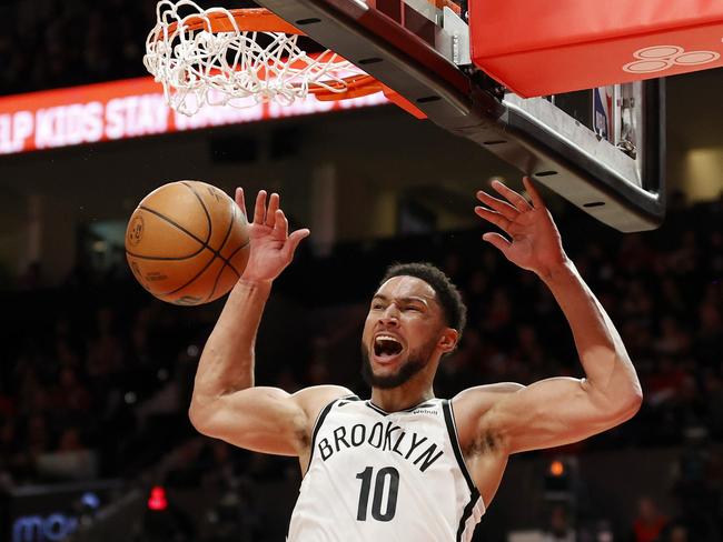 Ben Simmons roars after throwing one down against the Trailblazers. Picture: Getty Images