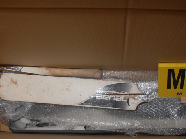 A broken cricket bat used during the assault.