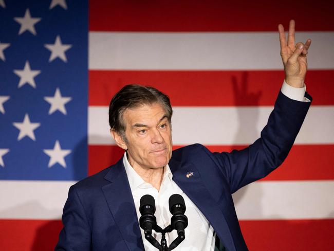 (FILES) Republican US Senatorial candidate for Pennsylvania, Mehmet Oz, gestures as he speaks during a campaign rally in Elizabethtown, Pennsylvania, on November 2, 2022. President-elect Donald Trump on November 19, announced the nomination of Dr. Mehmet Oz to serve as the Centers for Medicare and Medicaid Services (CMS) Administrator. (Photo by Ryan Collerd / AFP)