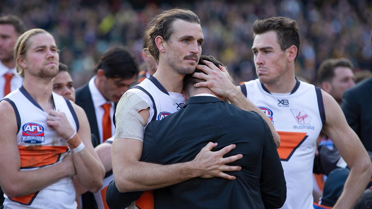 Phil Davis hugs Stephen Coniglio after the 2019 Grand Final loss.