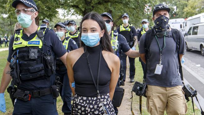 *WARNING - STRICTLY DO NOT PUBLISH BEFORE SPEAKING TO PIC DESK* - MELBOURNE, AUSTRALIA - NewsWire Photos FEBRUARY 20, 2021: Herald Sun Reporter Olivia Jenkins and photographer Jake Nowakowski are arrested at an Anti Vaccination protest at Fawkner Park in Melbourne on Saturday afternoonPicture: NCA NewsWire / David Geraghty