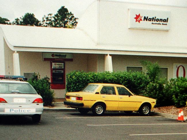 File/pic/Qld/Police - Yellow stolen getaway car outside the NAB during hold-up at Browns Plains during which Constable Neil Scutts was shot, 24 mar 1999. The crime remains unsolved - Pic/Supplied crime qld robbery shooting buildings exterior