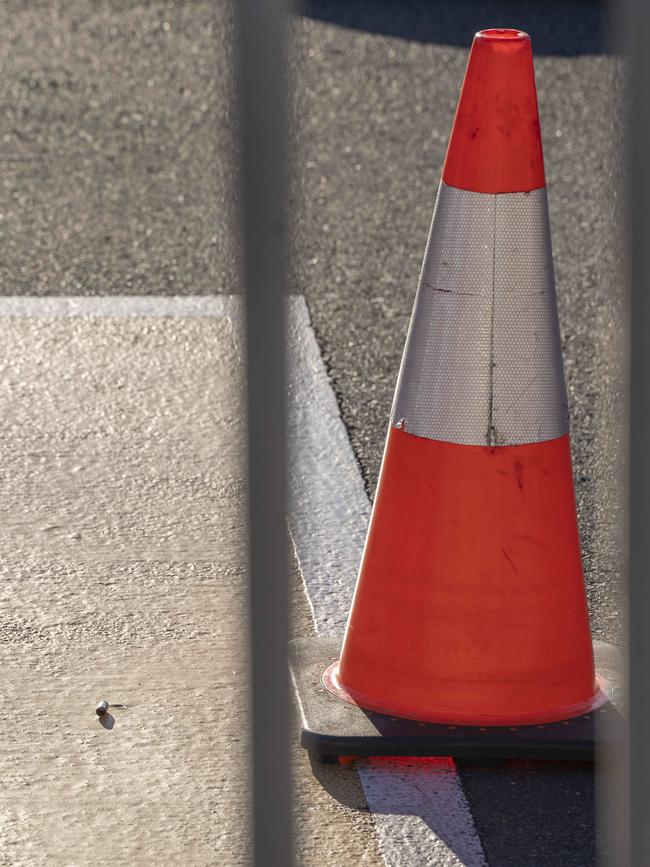 A bullet shot casing sitting was located near the orange witches hat. Picture: Matthew Vasilescu