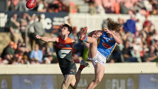 Sam Taylor makes a big spoil on Bailey Humphrey. Picture: Brett Hemmings/AFL Photos/via Getty Images