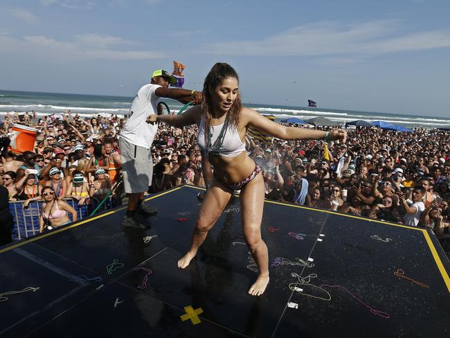 People celebrate on the beach at Clayton's Beach Bar and Grill in South Padre Island. Picture: EPA/Larry W. Smith