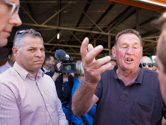 Local Eugowra resident Peter Jones confronted Premier Dominic Perrottet. Picture: Jenny Evans/Getty Images