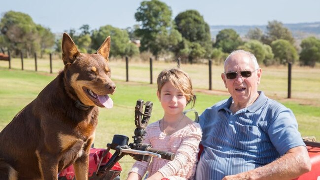 Kenny Andersson (right) with his beloved granddaughter Ellenor and Red Dog the kelpie. Picture: Nancy Jayde Photography