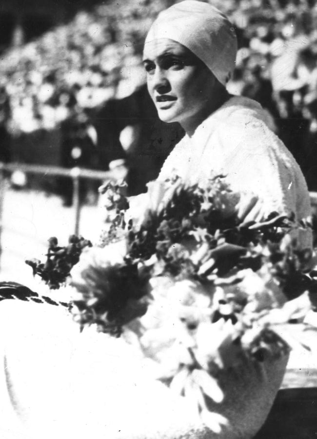 Australian swimmer Clare Dennis with flowers after winning the 220 yards breaststroke at the 1932 Los Angeles Olympics.