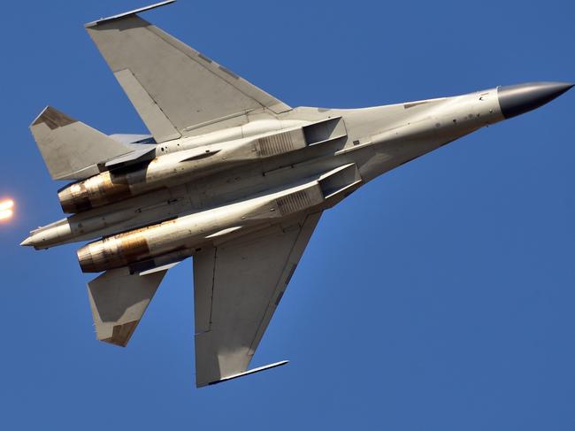 The moment of a Chinese Air Force fighter launching jamming bombs. Picture: Getty