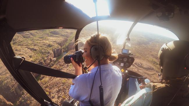 A tourist enjoying a helicopter flight over Nitmiluk National Park with North Australian Helicopters. Picture: Katherine Visitor Information Centre