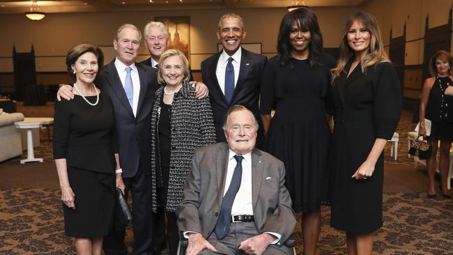 This Saturday, April 21, 2018, photo provided by the Office of former U.S. President George H.W. Bush, shows Bush, front center, and past presidents and first ladies Laura Bush, from left, George W. Bush, Bill Clinton, Hillary Clinton, Barack Obama, Michelle Obama and Melania Trump in a group photo at the funeral service for first lady Barbara Bush, in Houston. Barbara Bush died Tuesday, April 17. She was 92. (Paul Morse/Courtesy of Office of George H.W. Bush via AP)