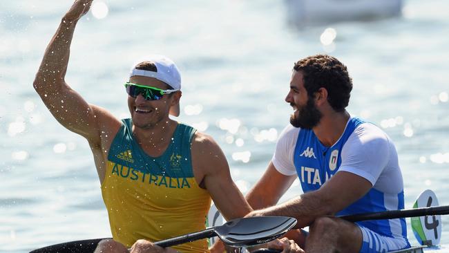 Stephen Bird, alongside Manfredi Rizza of Italy, reacts after producing a personal best in the K2 200m.