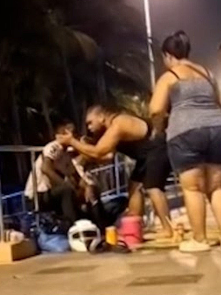 An unruly tourist can be seen slapping Thai street vendors. Picture: Asia Pacific Press