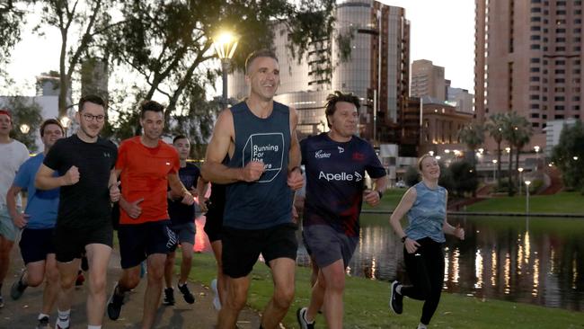 Peter Malinauskas sets the pace along the banks of the River Torrens on Wednesday morning. Picture: Dean Martin