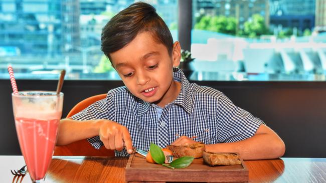 Reid gets stuck into one of the meals at Dinner by Heston. Picture: Tony Gough