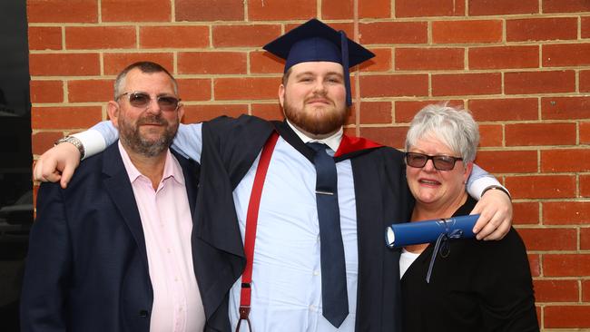 Graduate Harrison Beaumont with dad Philip and mum Suzi at the Deakin University Graduation post ceremony celebration. Picture: Alison Wynd