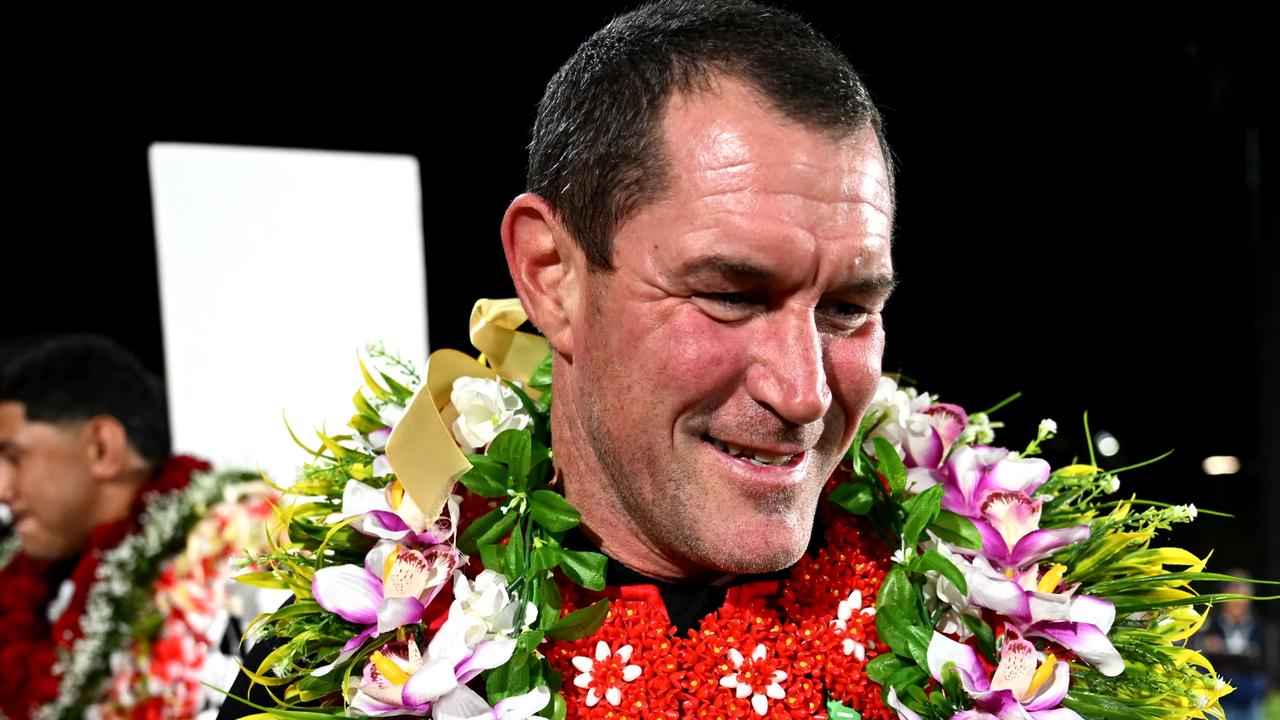 AUCKLAND, NEW ZEALAND - NOVEMBER 02: Head coach Kristian Woolf of Tonga celebrates with a fan after winning the men's 2024 Rugby League Pacific Championship match between New Zealand Kiwis and Tonga XIII at Go Media Stadium on November 02, 2024 in Auckland, New Zealand. (Photo by Hannah Peters/Getty Images)