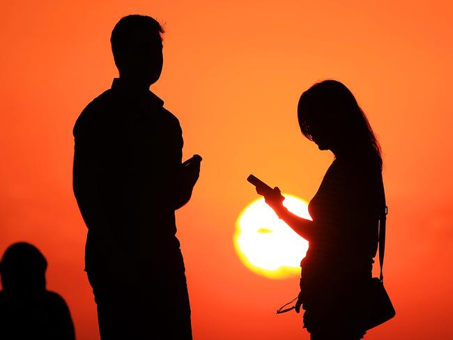 The sun sets at St Kilda beach before a day of extreme heat. Picture: Mark Stewart