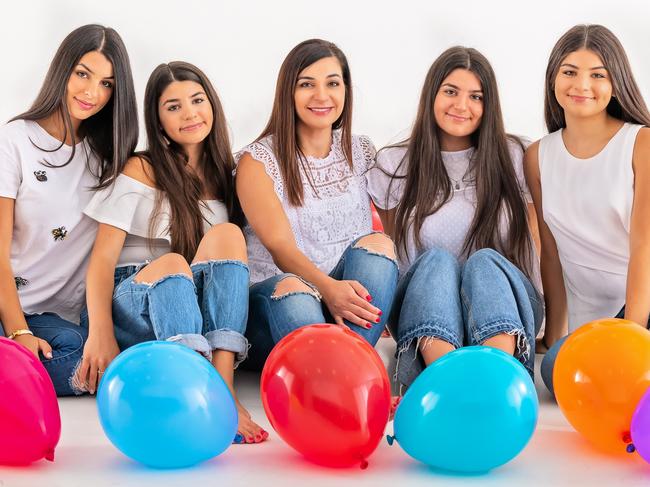 Fatima Dib, 45, (centre) with daughters Elyssar Dib, 19, Zahra Dib, 13, and twins Jenan Dib and Nadine Dib, both 17. Picture: Lee Bird Photography