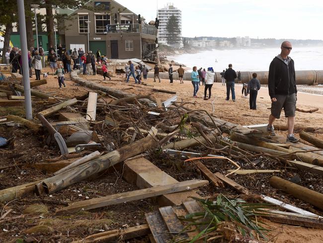 Residents gather at the beachfront in Collaroy. Picture: AFP