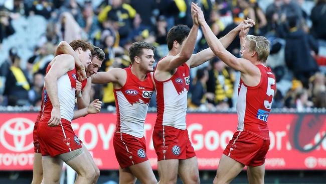 Sydney players celebrate Gary Rohan’s last-quarter goal. Picture: George Salpigtidis