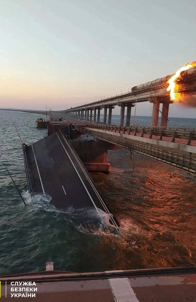 Released by the Security Service of Ukraine, this photo shows a fire sparked by a car bomb that has broken out on a key bridge linking Crimea to Russia, near Kerch. Picture: AFP