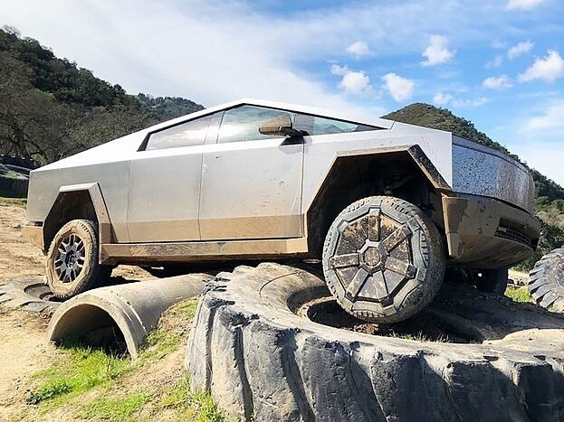 The WSJ's Dan Neil test drives the Tesla Cybertruck. ABS OF STEEL The test vehicle, a Tesla Cybertruck AWD Foundation Series ($100,000, as tested), landed hard on a concrete culvert at a 4×4 obstacle course near Hollister, Calif. A double-layer of ultra-hard stainless steel (2.3 mm) protects the battery pack from damage. A later inspection found scratches but no dents or deformation. PHOTO: DAN NEIL/THE WALL STREET JOURNAL