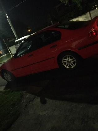 A car parked across a driveway at Corinda.