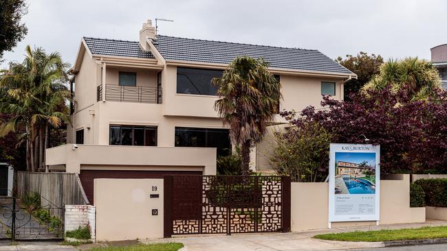 The house two doors down is spruiked as a “tri-level family masterpiece” with pool and spa. Picture: Mark Dadswell