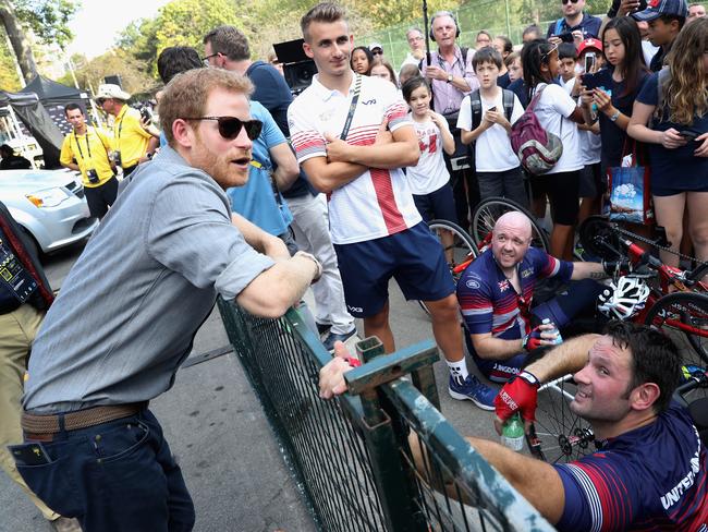 Prince Harry meets up with cyclists as he attends the Cycling Criterium time trial during the Invictus Games. Picture: Getty