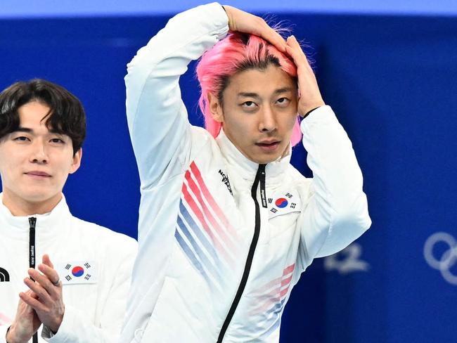 Silver medallist South Korea's Kwak Yoon-gy (C) celebrates with teammates during the venue ceremony of the men's 5000m relay short track speed skating event during the Beijing 2022 Winter Olympic Games at the Capital Indoor Stadium in Beijing on February 16, 2022. (Photo by SEBASTIEN BOZON / AFP)