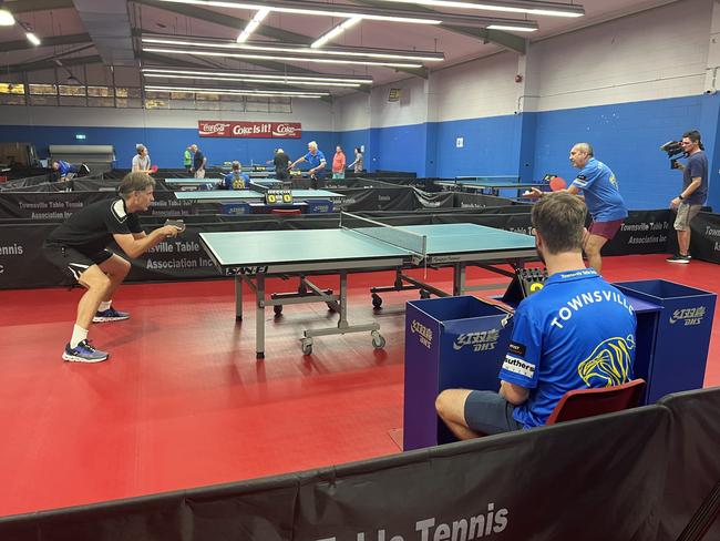 Game of Thrones star Nikolaj Coster-Waldau, left, playing at the Townsville Table Tennis club on March 19.