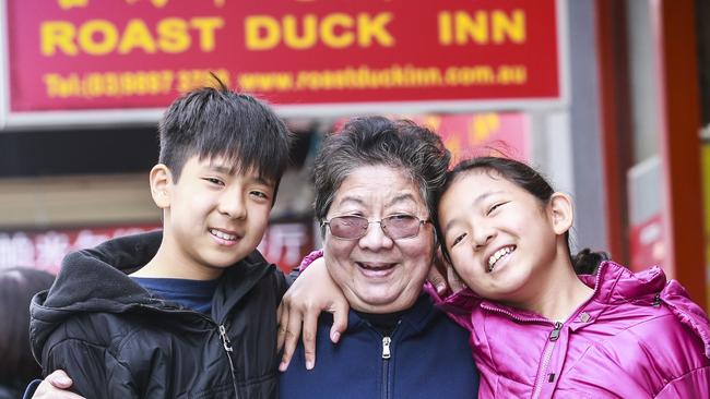 Reuben She, Tan Gooi Eng. and Kaitlyn She from Box Hill, which has a large Asian population. Picture: Wayne Taylor